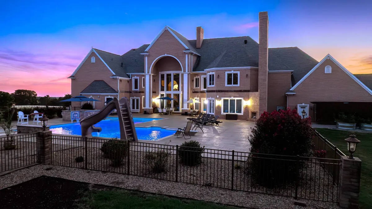 Luxury estate with pool and patio at sunset, 6708 Brown Ln, Poplar Bluff, Missouri &mdash; sold by Delta Realty, LLC